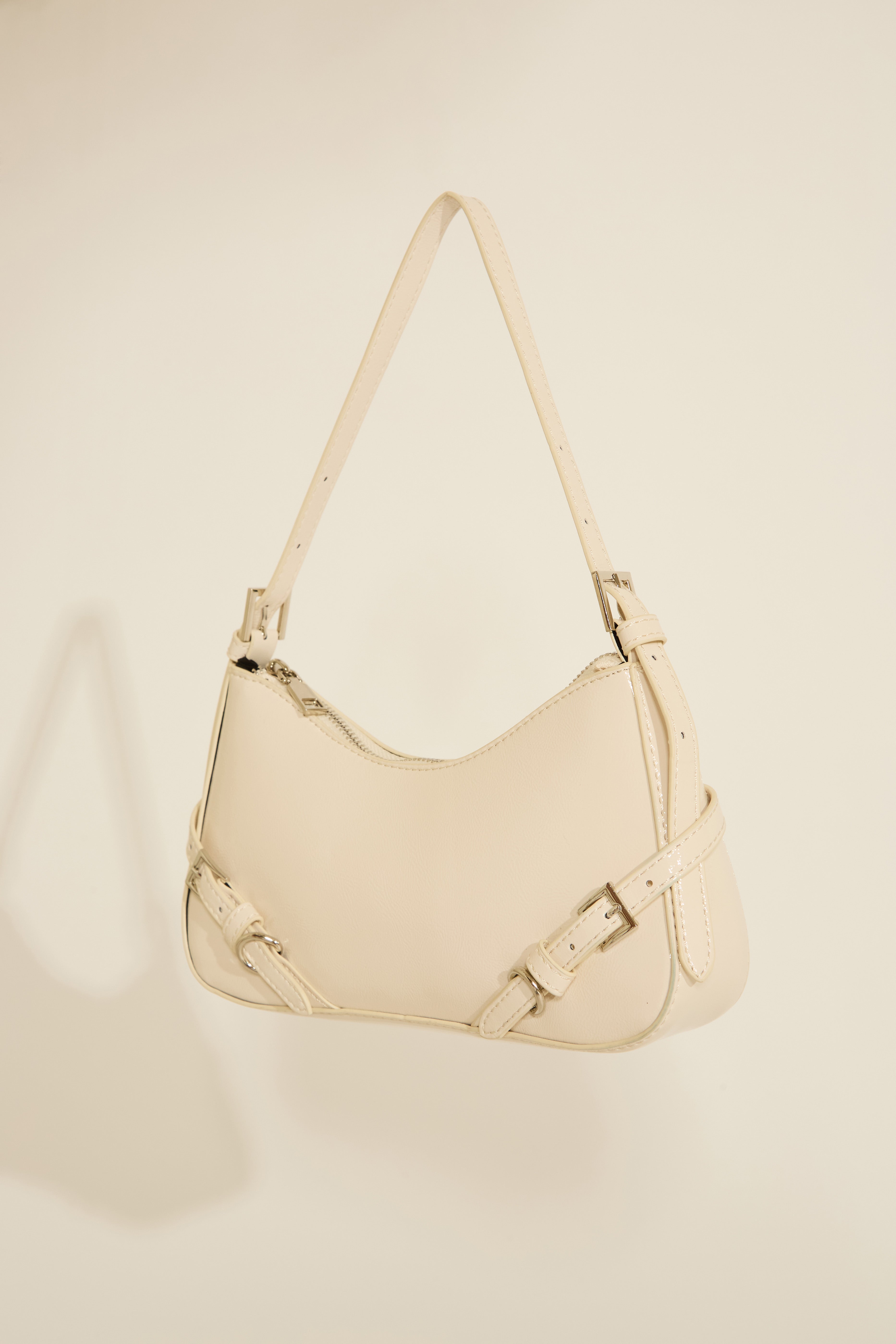 VEGAN LEATHER SHOULDER BAG WITH STRAP DETAILS