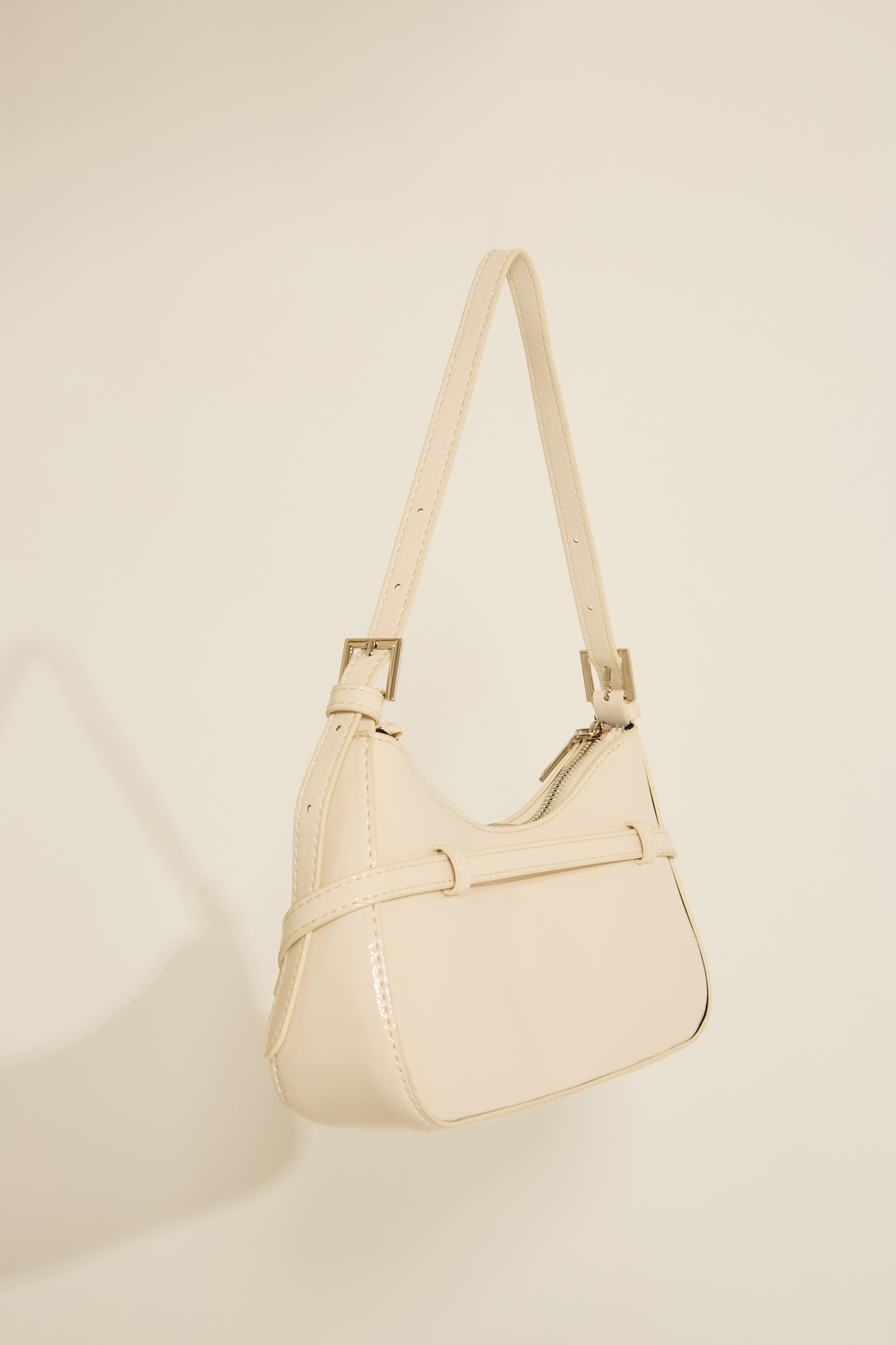 VEGAN LEATHER SHOULDER BAG WITH STRAP DETAILS