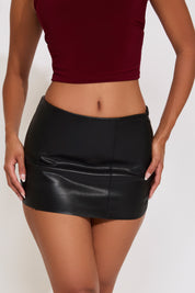 FRONT SEAMS VEGAN LEATHER LOW RISE MINI SKIRT