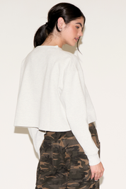 CONTRAST NUMBER 84 LONG SLEEVE CROPPED TOP