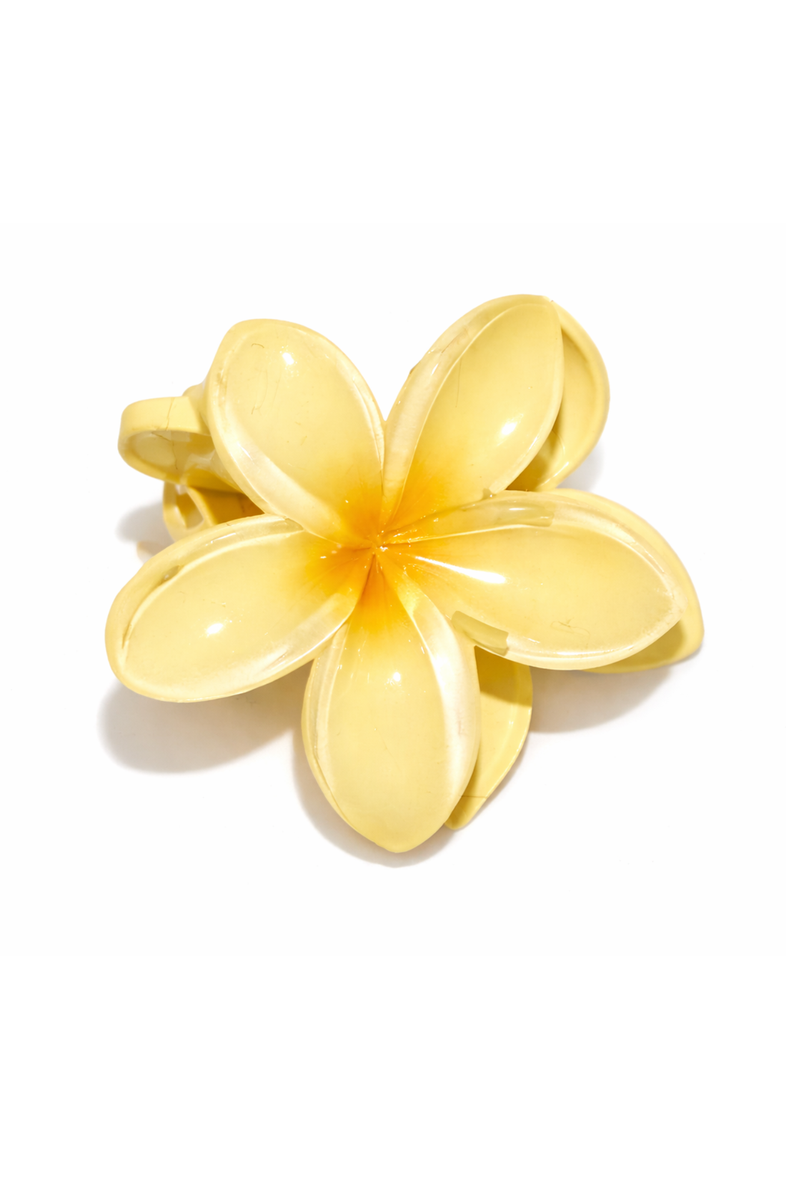 Woman with a yellow flower in her hair, wearing a pink bikini, against a white background