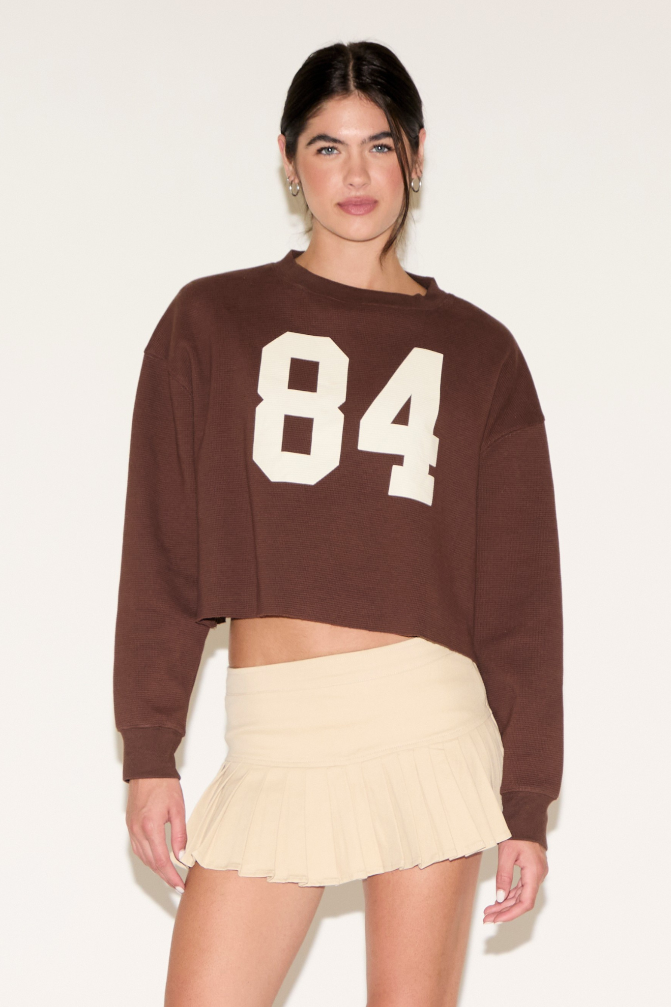 CONTRAST NUMBER 84 LONG SLEEVE CROPPED TOP