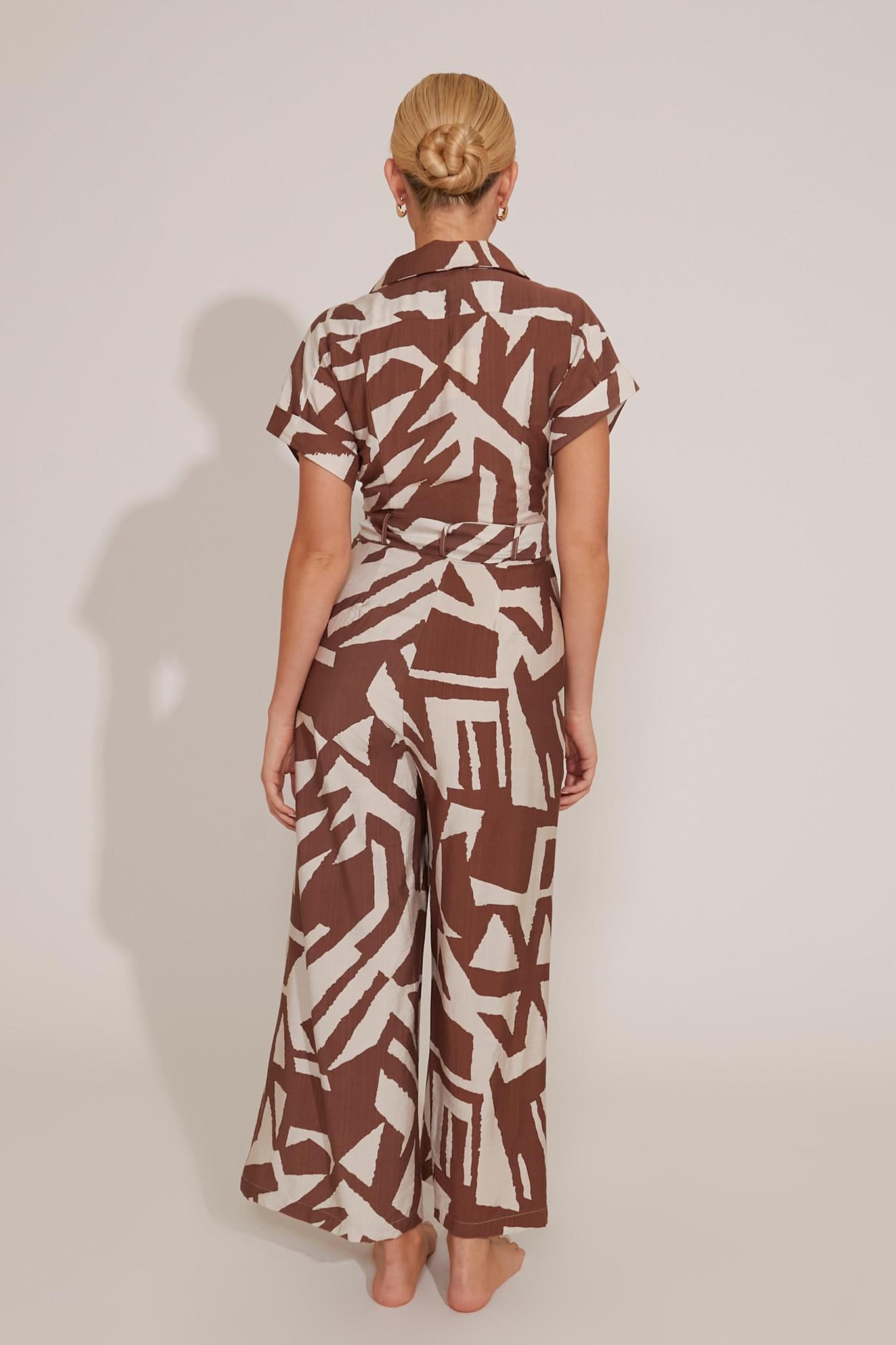 SHORT SLEEVED BUTTON-UP GRAPHIC PRINT WAIST-TIE JUMPSUIT