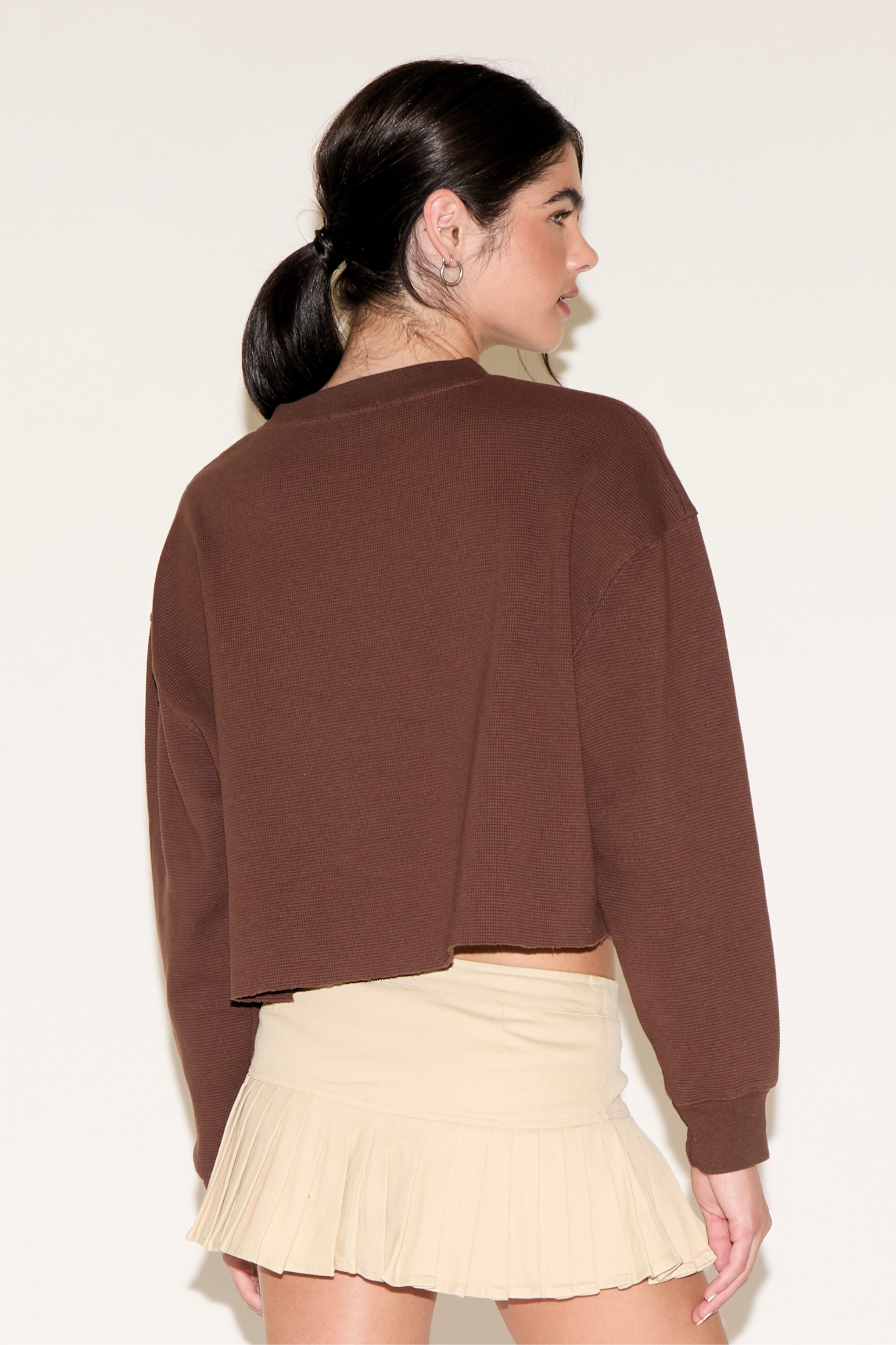 CONTRAST NUMBER 84 LONG SLEEVE CROPPED TOP