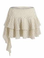 Ghost mannequin photo of a cream POLKA DOT TIERED RUFFLE SKORT on a white background. 