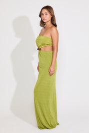 Model is wearing a green metal detail strapless cutout maxi dress on a white background.