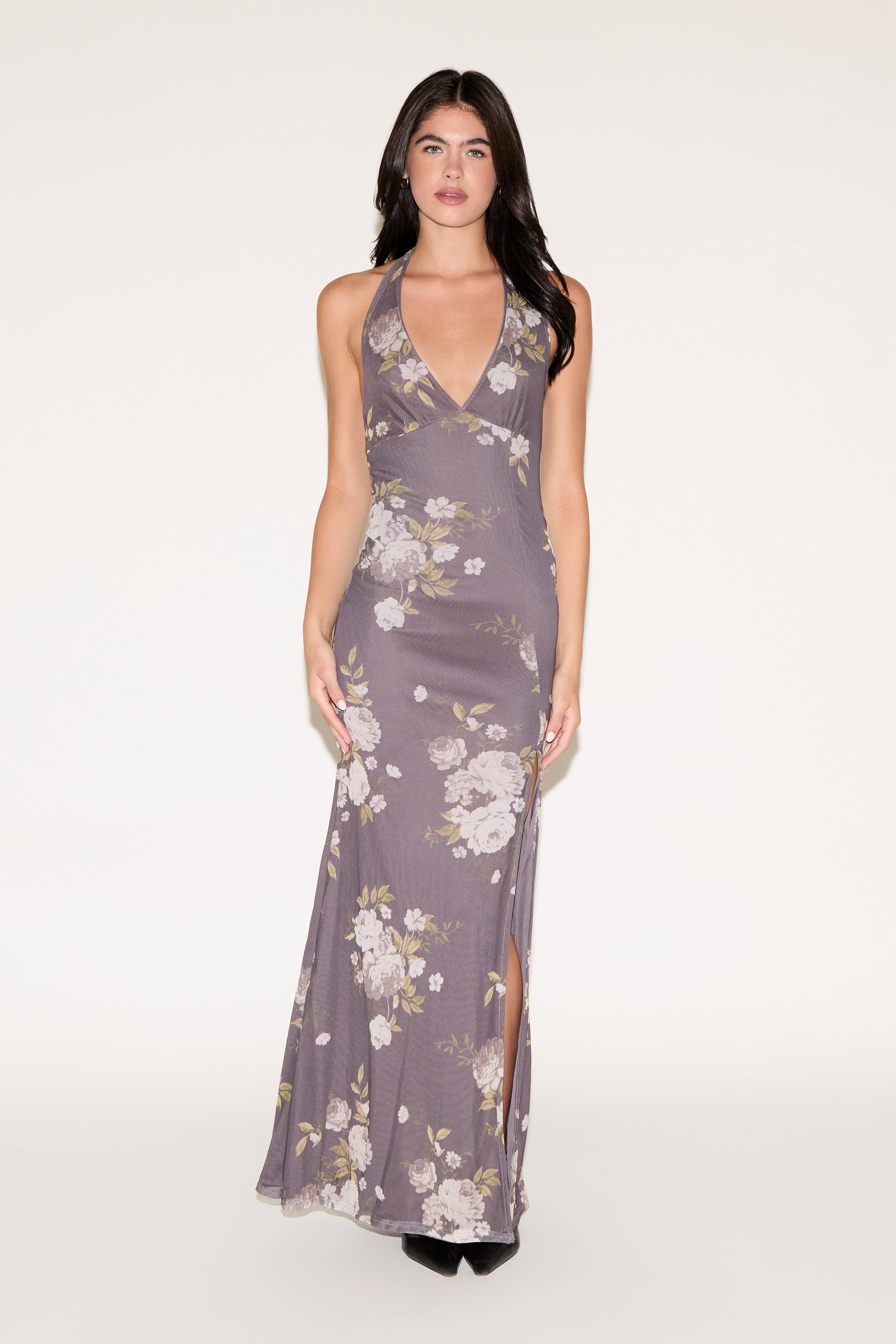 Woman wearing a floral dress on a white background