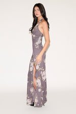 Woman wearing a floral dress on a white background