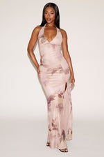 Woman wearing a floral dress against a white background