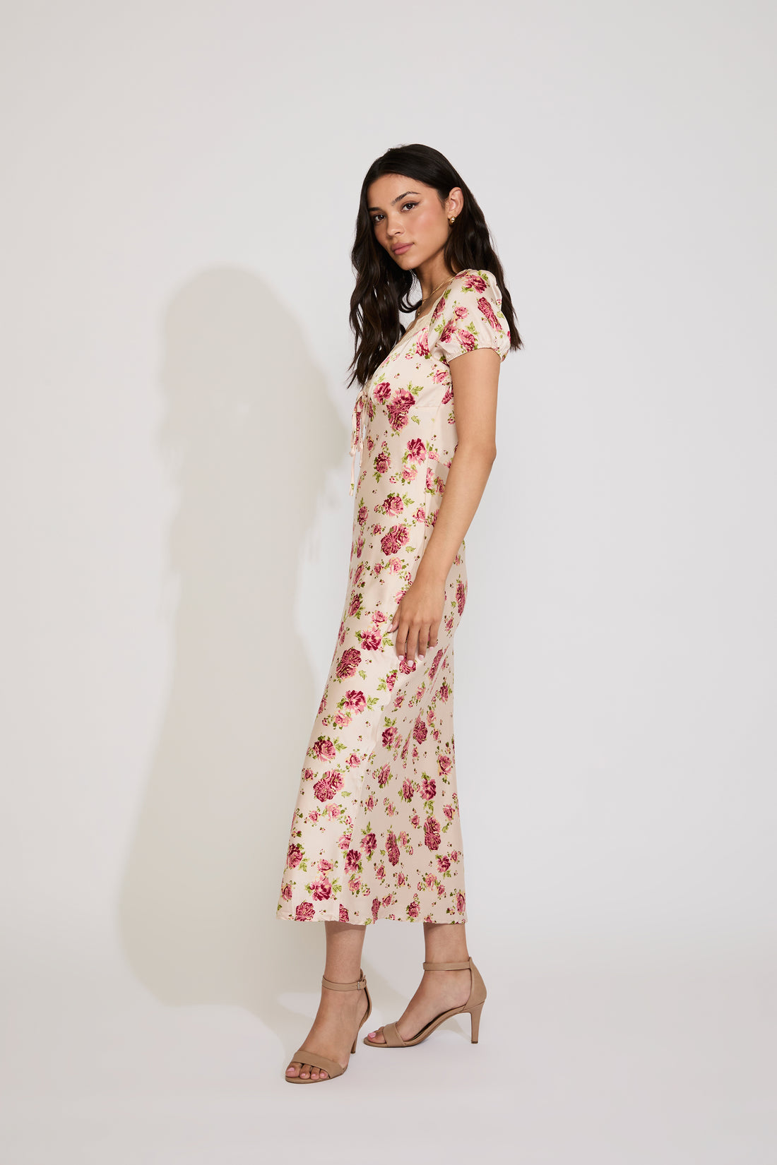 Woman wearing a floral dress on a white background