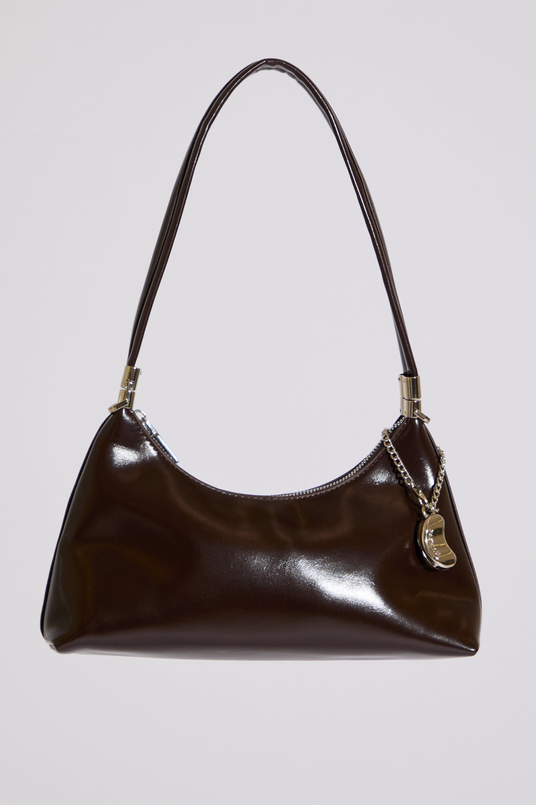 Brown handbag with a chain detail on a light gray background