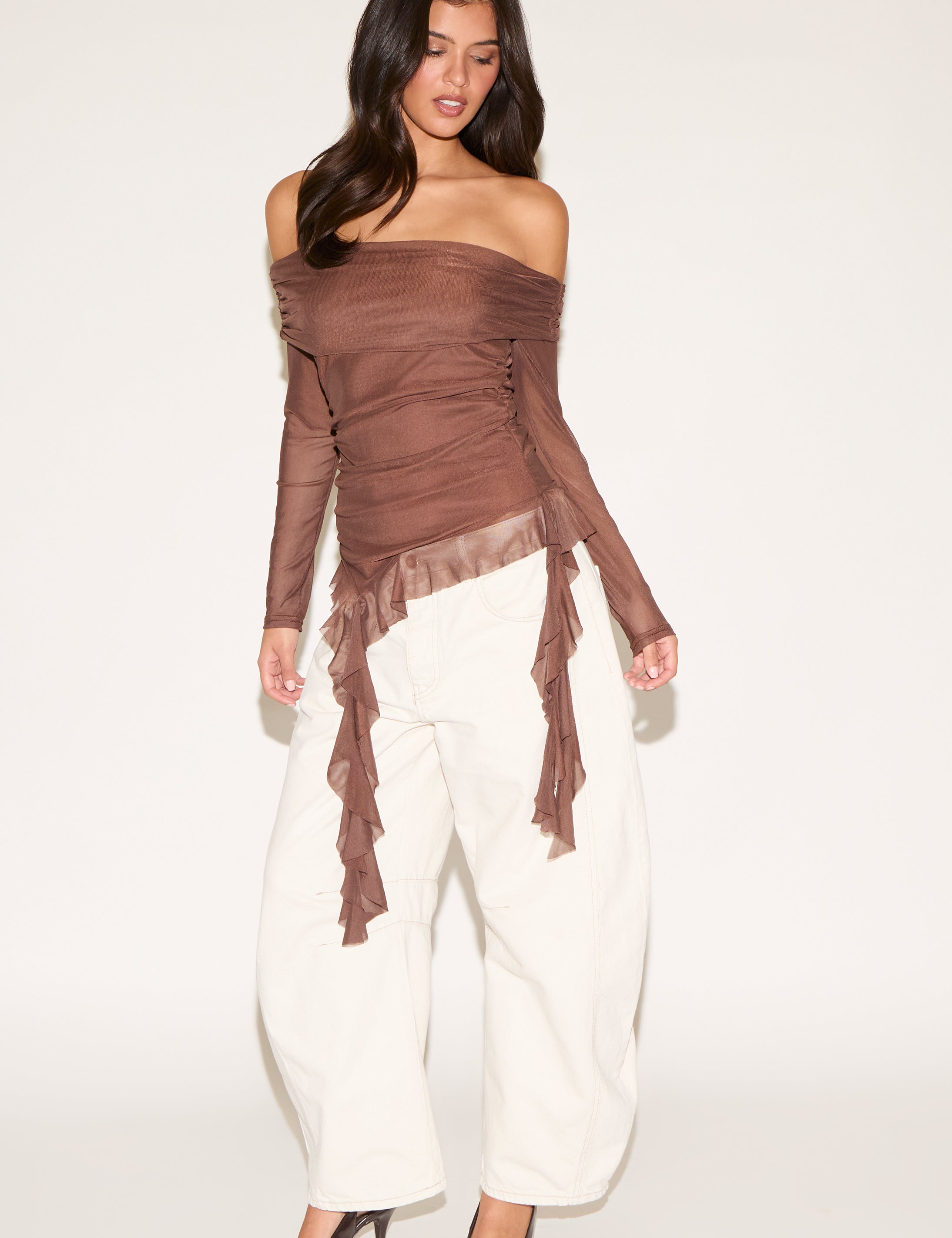 OFF SHOULDER LONG SLEEVE TOP WITH ASYMMETRIC RUFFLE HEM