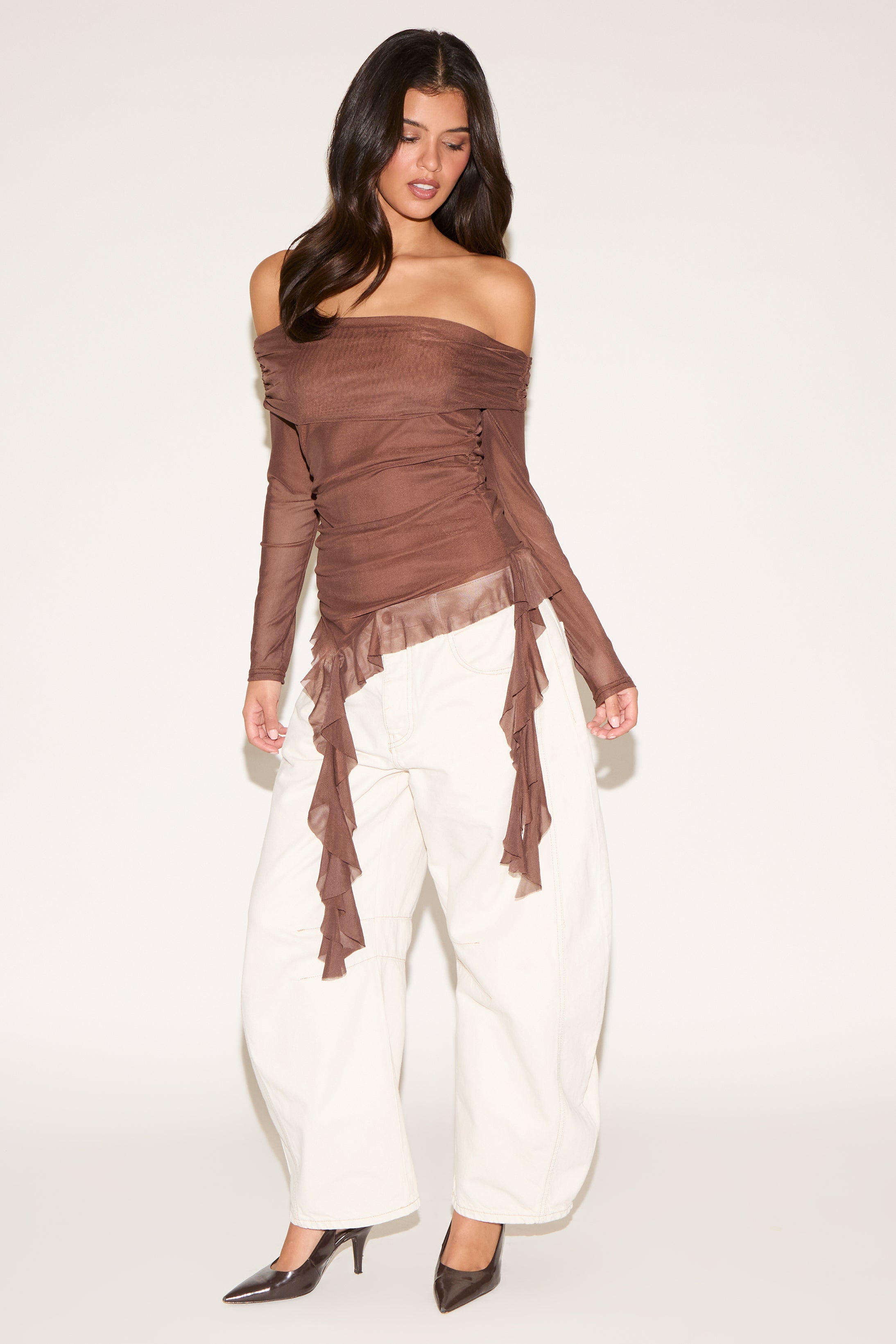 OFF SHOULDER LONG SLEEVE TOP WITH ASYMMETRIC RUFFLE HEM