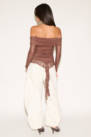 OFF SHOULDER LONG SLEEVE TOP WITH ASYMMETRIC RUFFLE HEM
