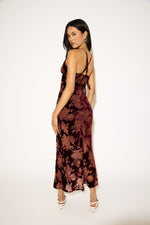 Woman wearing a floral dress on a white background