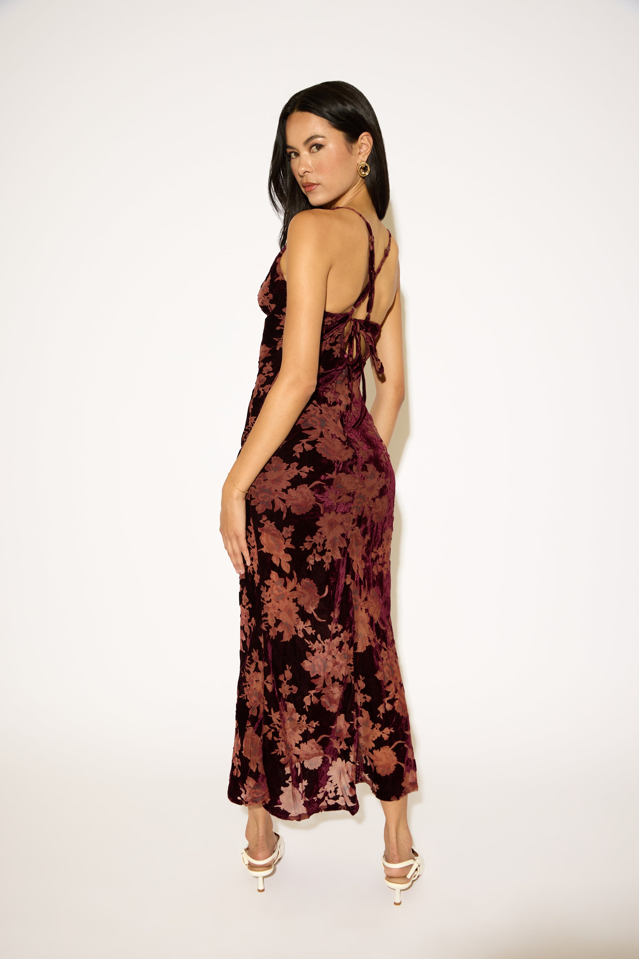 Woman wearing a floral dress on a white background
