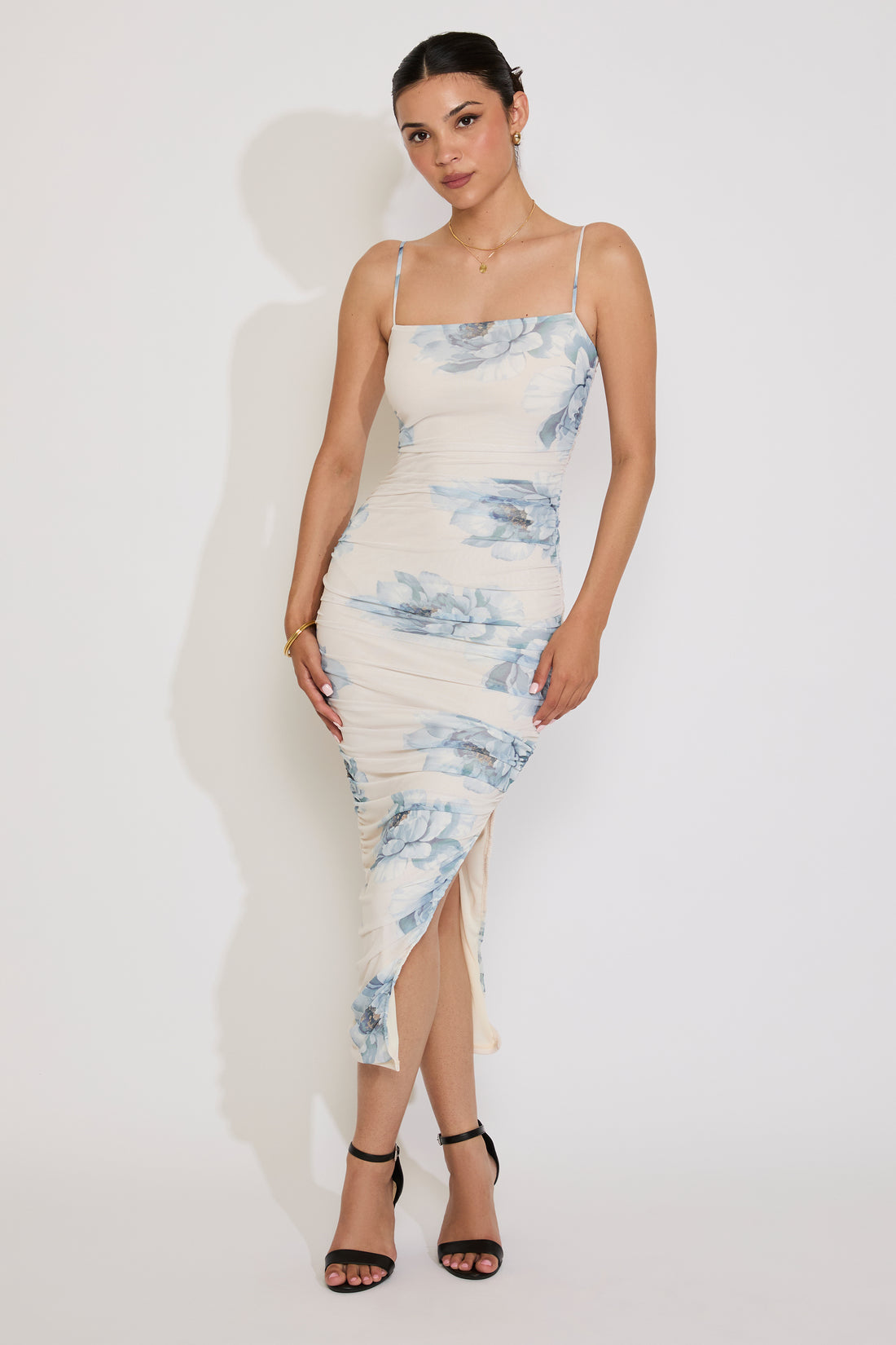 Woman wearing a floral dress on a white background