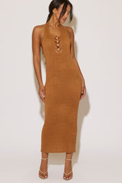 Woman wearing a brown dress with a white background