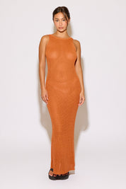 Woman wearing an orange dress on a white background