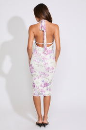 Model is wearing a FLORAL TIE DEEP V NECK BODYCON MIDI DRESS on a white background. 