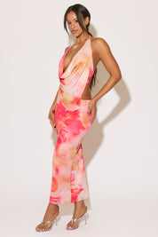 Woman wearing a colorful dress with a white background