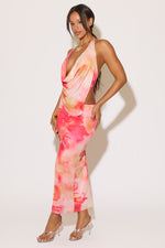 Woman wearing a colorful dress with a white background