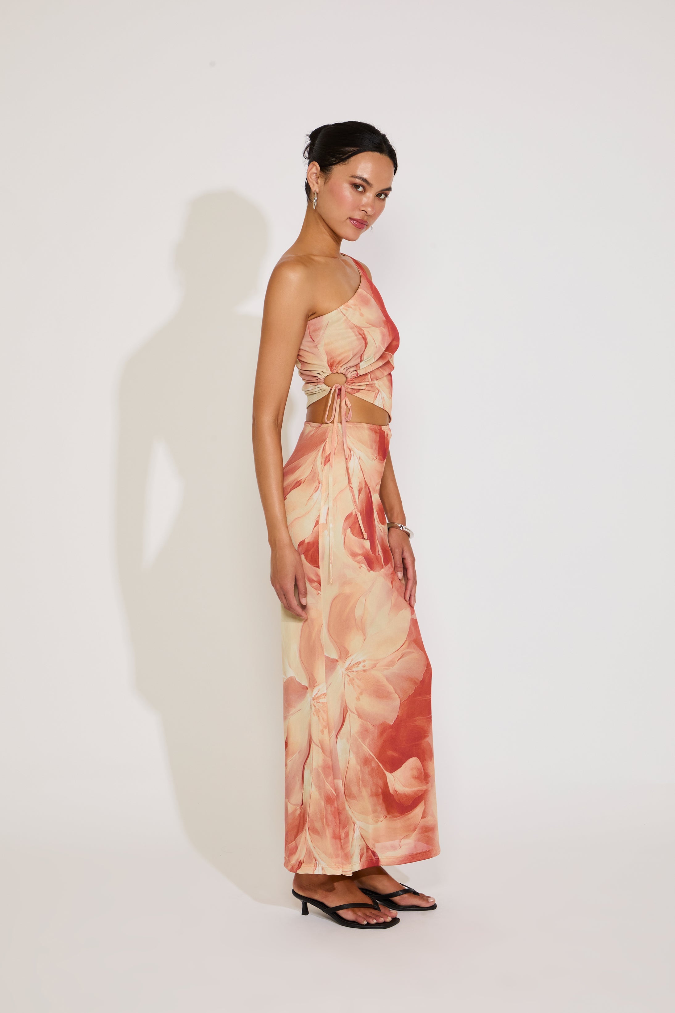 Woman wearing a floral dress on a white background