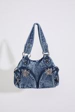MEDIUM DENIM HOBO STYLE BAG W BUTTERFLY DTL on a white background.