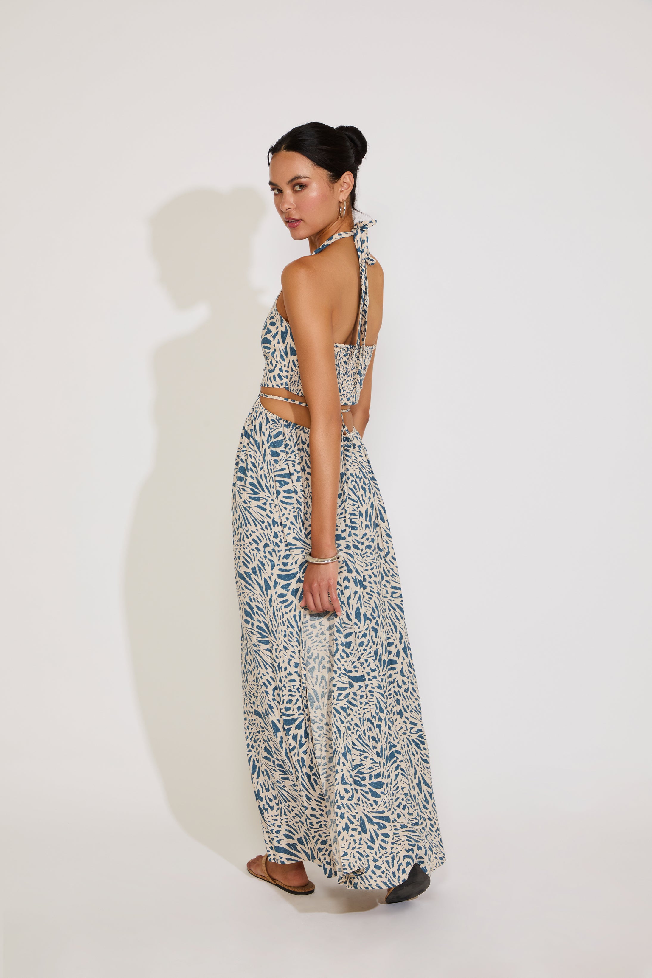 Woman wearing a floral dress with a white background