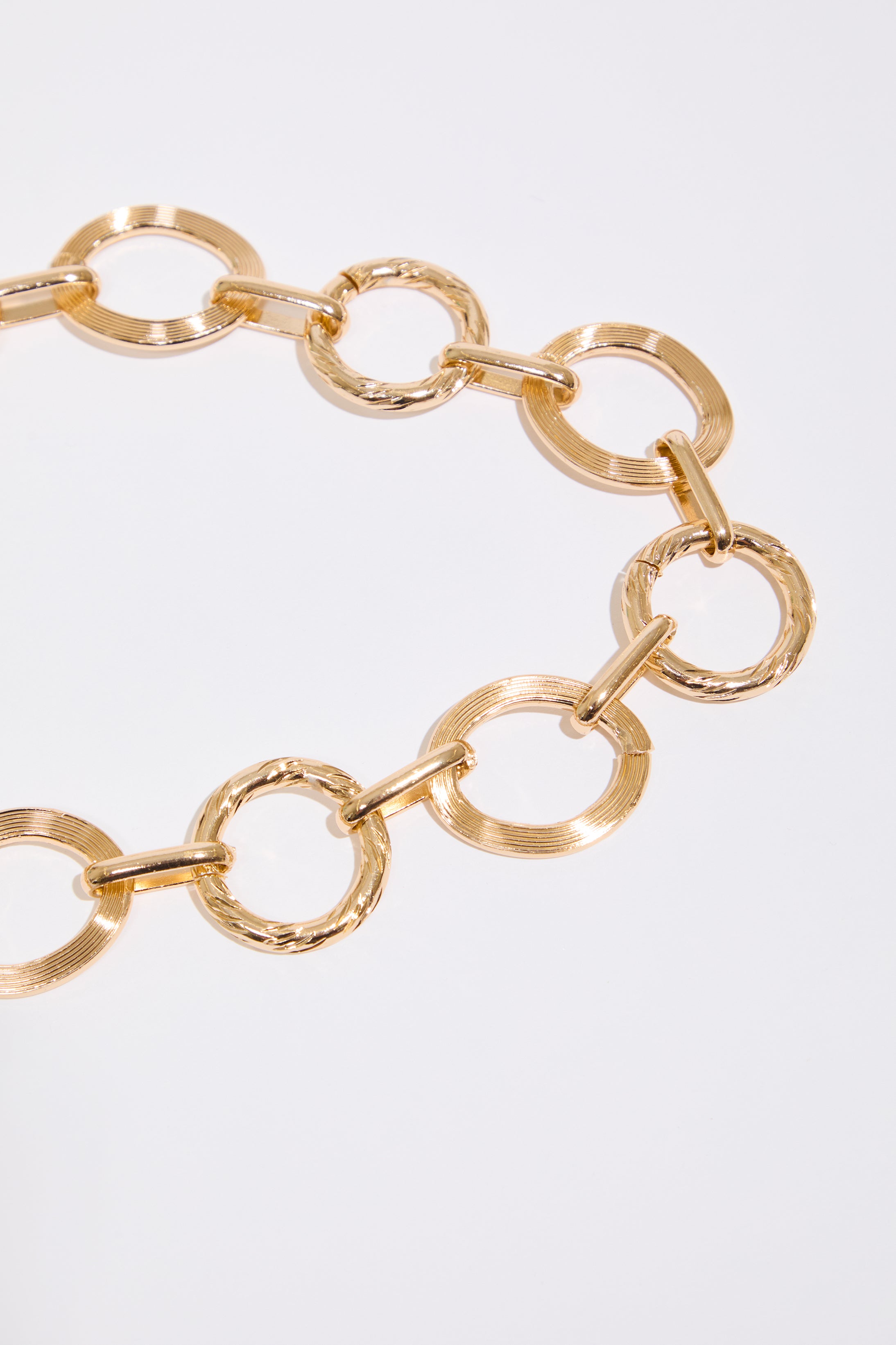 Gold METAL OVAL LINK CHAIN BELT  on a white background.