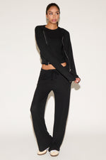 girl wearing black pants