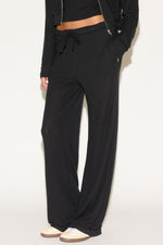 girl wearing black pants