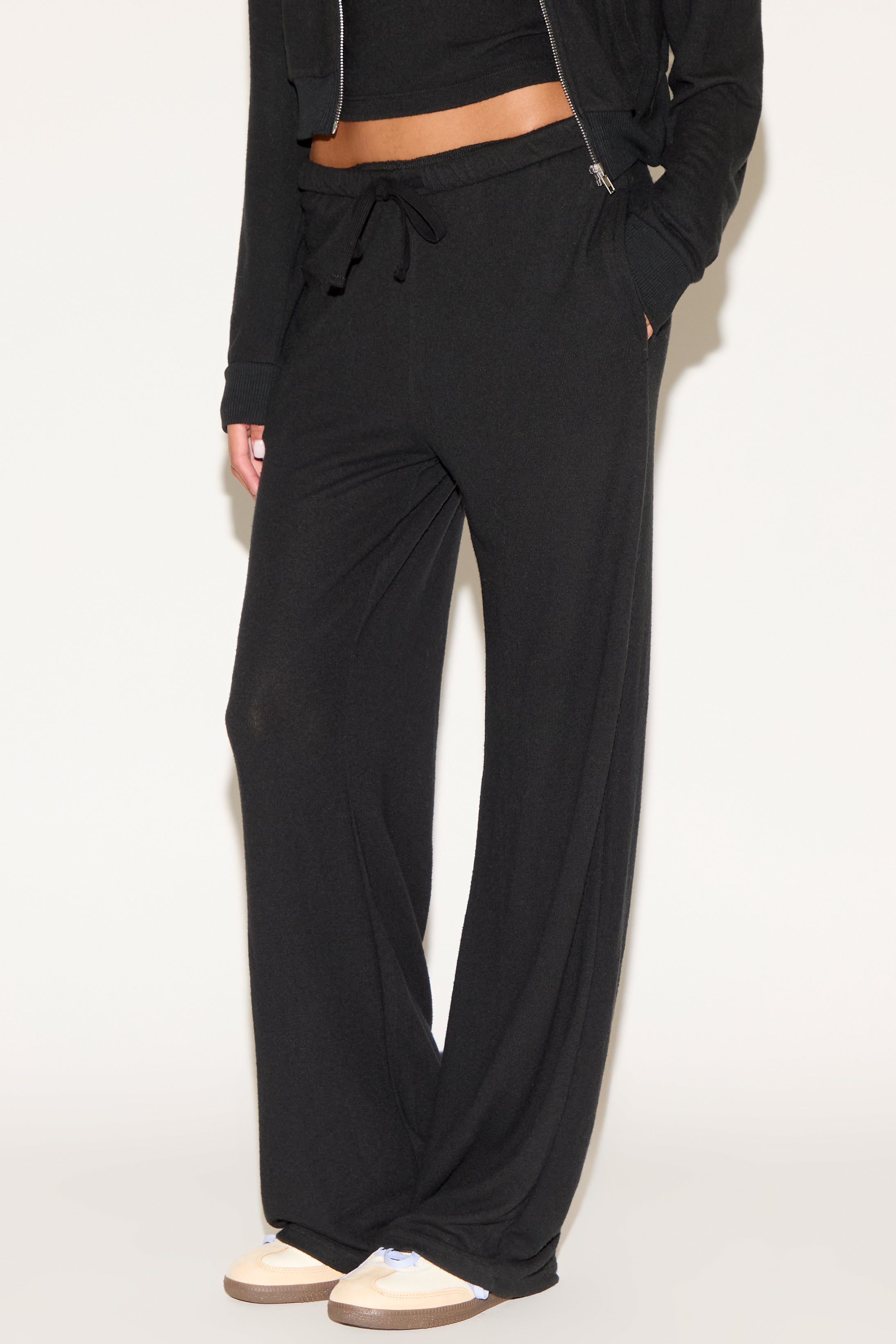 girl wearing black pants
