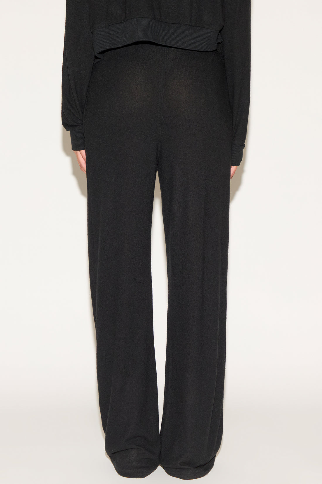 girl wearing black pants
