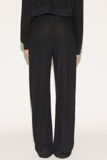 girl wearing black pants