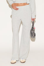 girl wearing grey pants