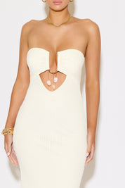 White strapless dress with cut-out design on a white background