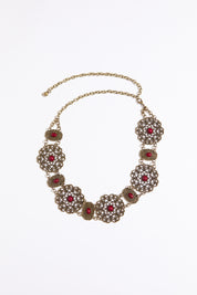 Cab accented filigree chain belt on a white background.