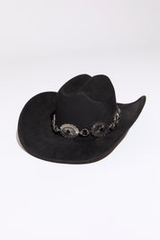 Black cowboy hat with stone accent concho beaded silver  chain on a white background. 
