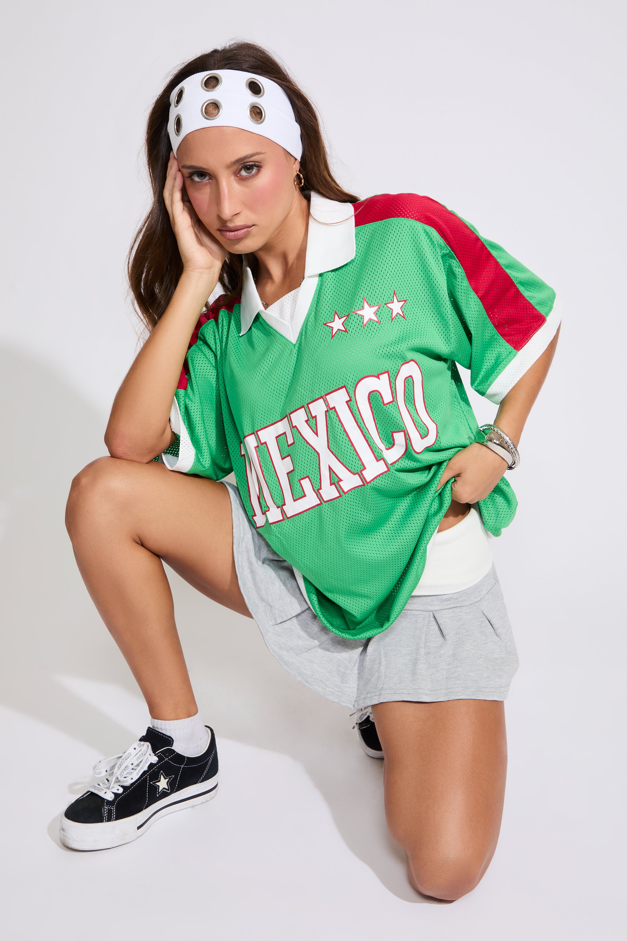 Model is wearing a green Mexico jersey with a heather grey skirt on a white background. 