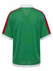 Ghost cut image of a green Mexico jersey on a white background.