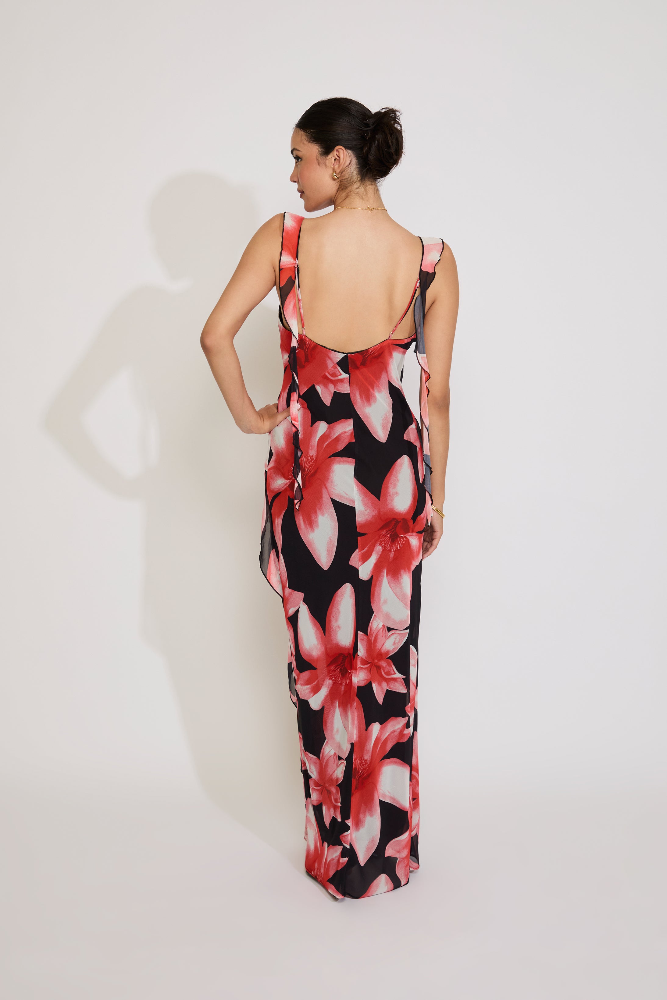 Woman wearing a floral dress with a white background