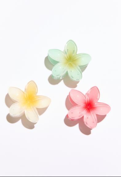 Three colorful flower-shaped objects on a white background