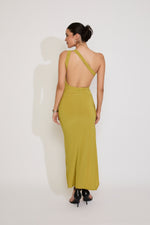 Woman wearing a green dress with a white background