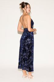 Woman wearing a blue sequin dress on a white background