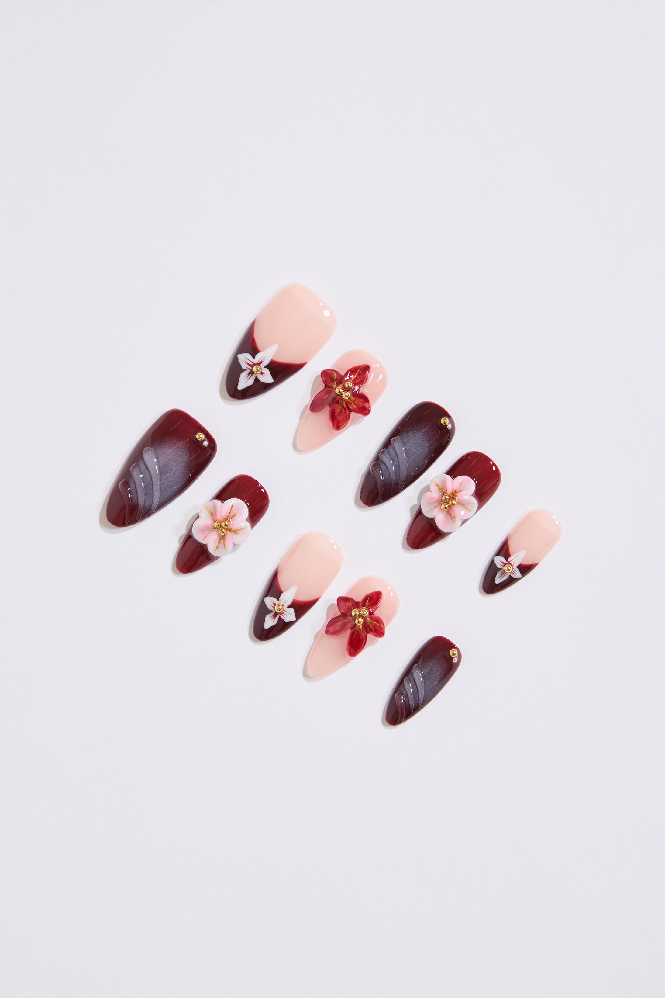 red ALMOND SHAPED 3D FLORAL ART GRADIENT PRESS ON Nail's on a white background. 