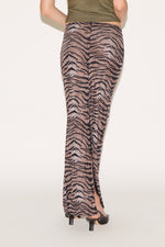 Zebra print skirt worn by a person on a white background