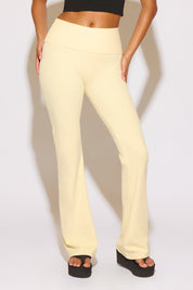 Light yellow pants worn by a person on a white background