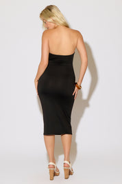 Model is wearing a metal neck ring sleeveless knit maxi black dress on a white background.