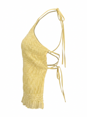 Ghost mannequin product image of a yellow SMOCKED TEXTURED OPEN BACK TIE NECK TOP on a white background.